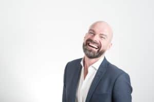 bald man laughing